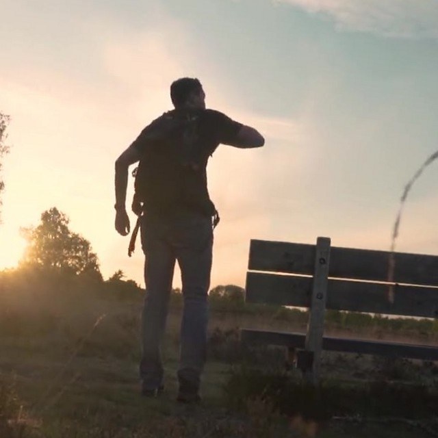 Hiker at sunset, horizon tilted