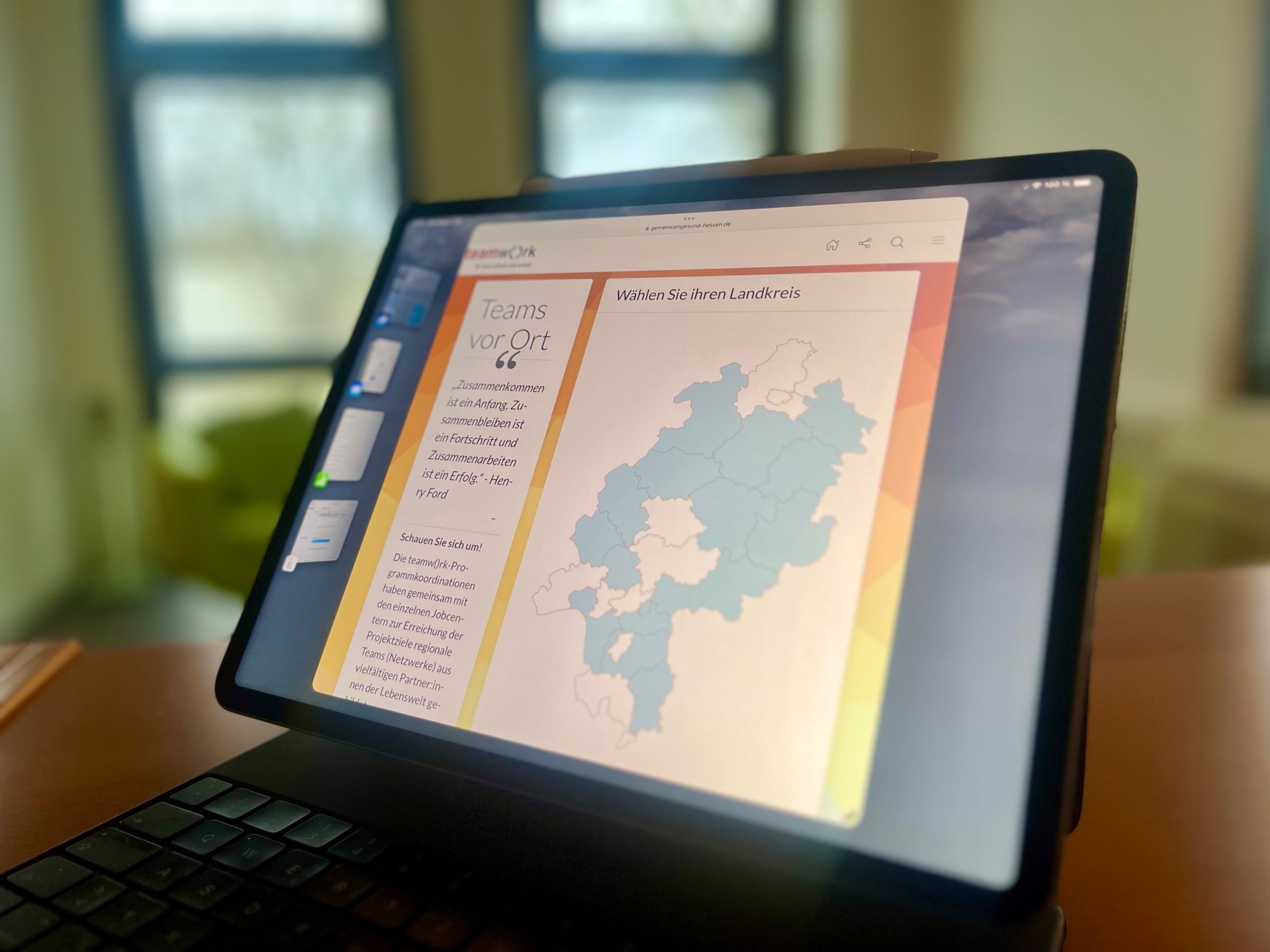 Tablet photographed at an angle: website with a map of Hesse