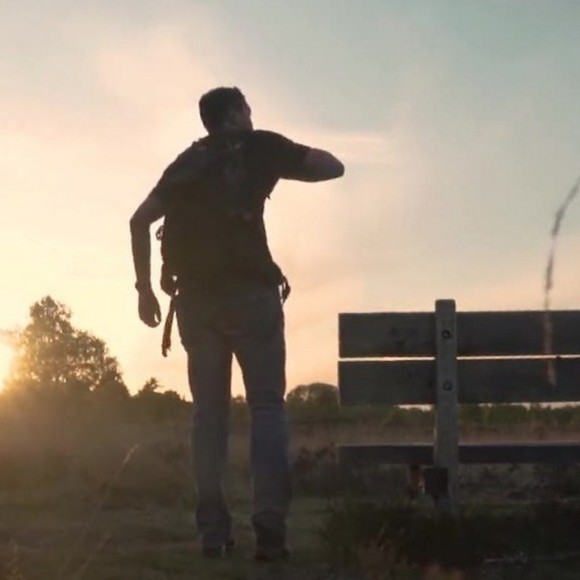 Hiker at sunset, horizon level
